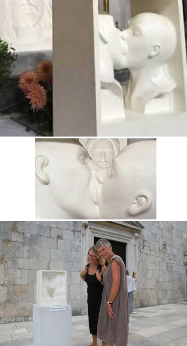 homosexuals kissing sculpture at altar 2